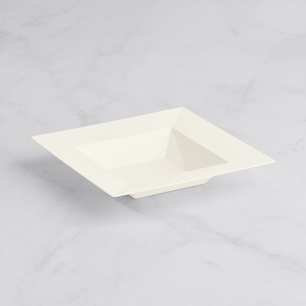 A white square Visions Florence plastic bowl on a white surface.