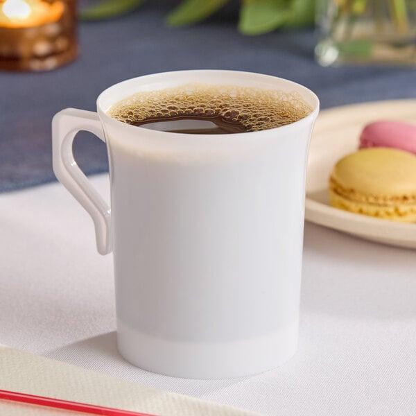 A white plastic coffee mug filled with coffee.