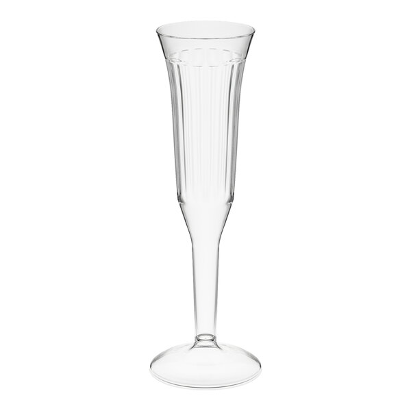 A clear 5 oz. plastic champagne flute with a fluted design.