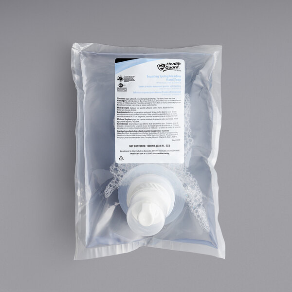 A plastic bag of 6 white Kutol Health Guard Spring Meadow Green hand soap bottles.