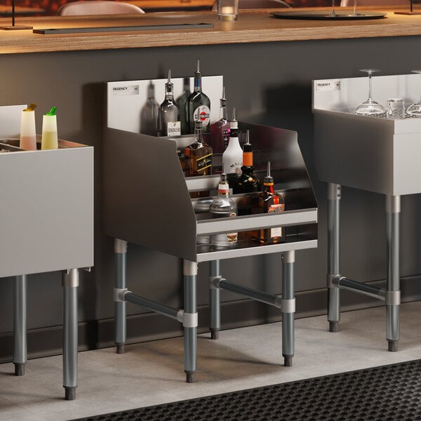 A five-tiered stainless steel liquor display rack filled with various bottles, designed for bar use.