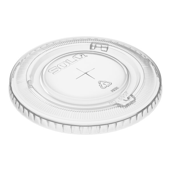A clear plastic Solo lid with a straw slot designed for 12 and 14 oz. containers.