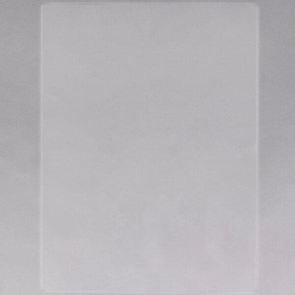 A white rectangular plastic sheet with black lines.