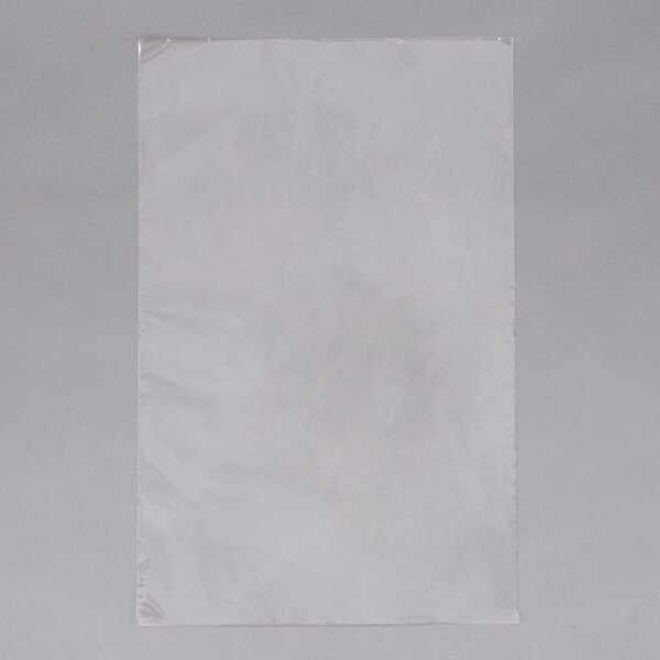 A white plastic bag on a gray surface.