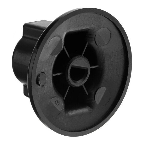 A black plastic Turbo Air control knob with a hole in the center.