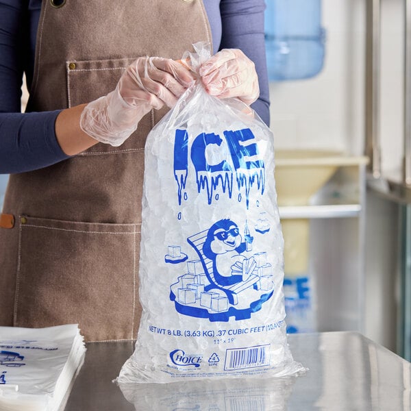 A clear plastic bag filled with ice, featuring blue printed text and a cartoon character, labeled as an 8 lb. ice bag.