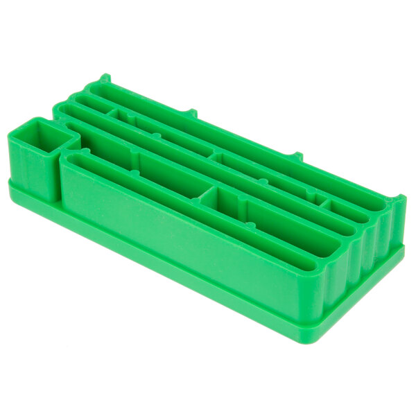 a close-up of a green plastic block