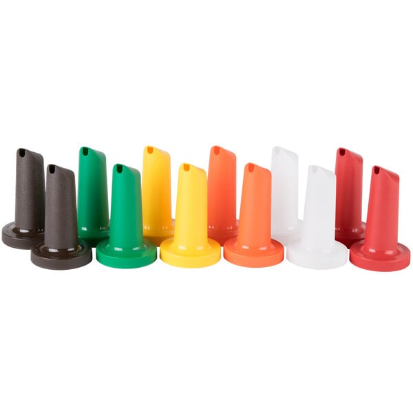 A white cylindrical object with colorful spouts and necks. The spouts and necks are green, red, yellow, and orange.