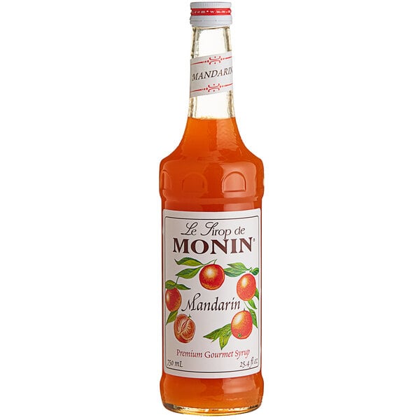 A bottle of Monin Premium Mandarin Fruit Syrup on a white background.