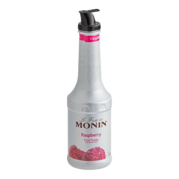 A Monin white bottle of raspberry fruit puree with a black lid.