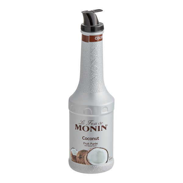 A close-up of a Monin white bottle of 1 Liter Coconut Fruit Puree with a black lid.