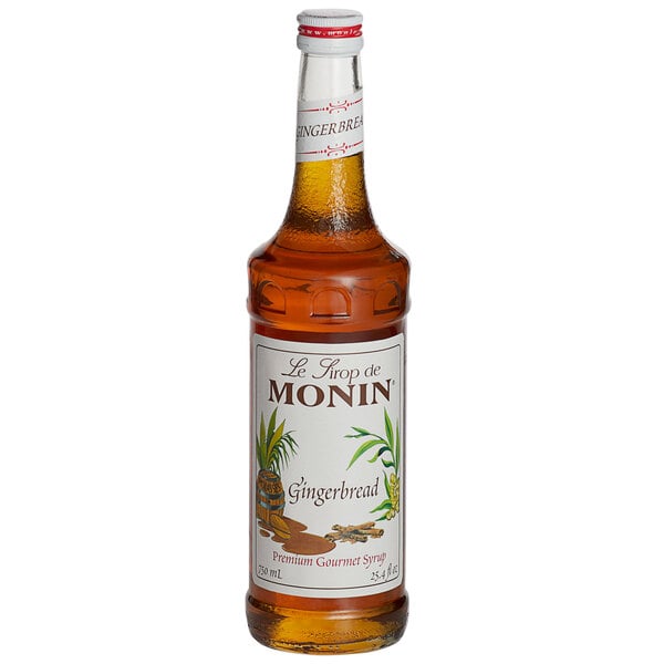 A bottle of Monin Premium Gingerbread Flavoring Syrup with a white label.