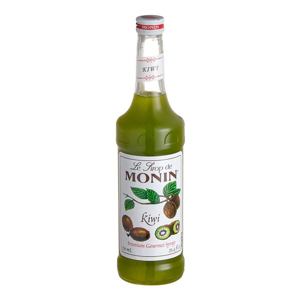 A green bottle of Monin kiwi syrup with a white label.
