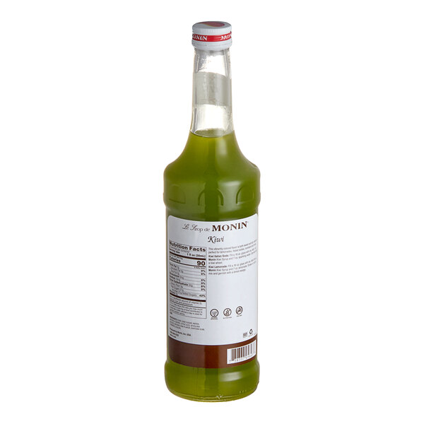 A green Monin bottle of kiwi fruit syrup.