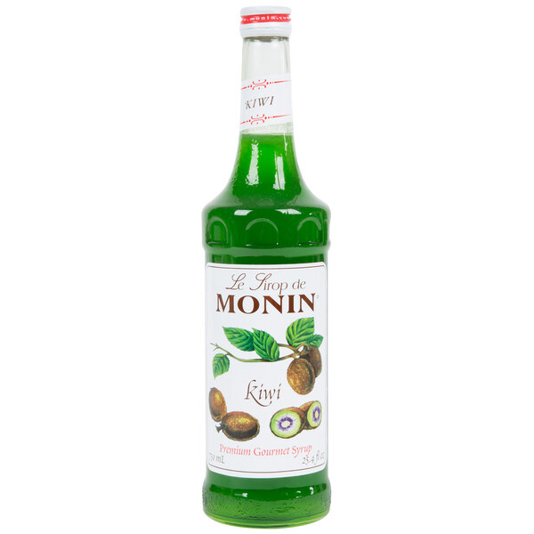 A green Monin bottle of kiwi syrup with a white label.