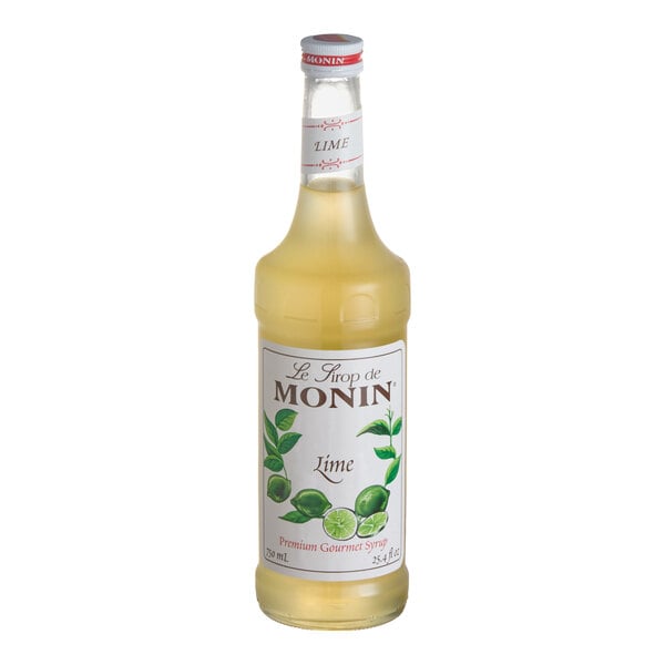 A bottle of Monin Premium Lime Flavoring / Fruit Syrup, 750 mL.