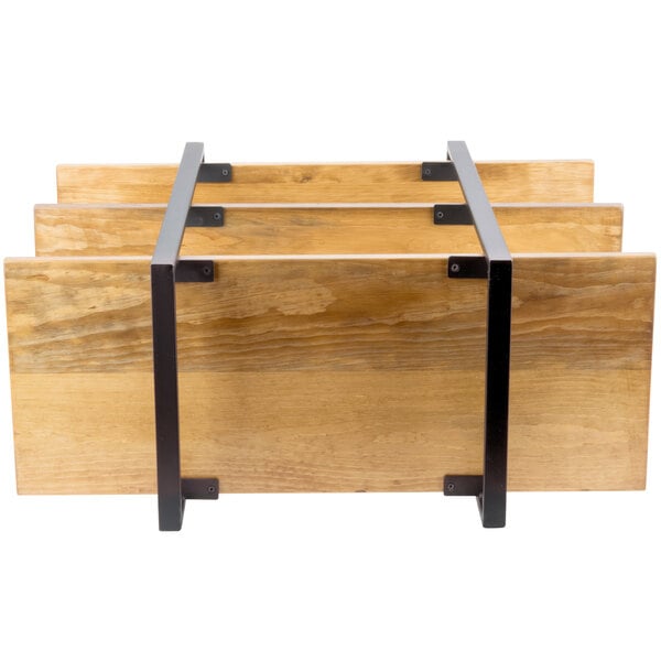 A wooden and metal rack with three shelves on a table.