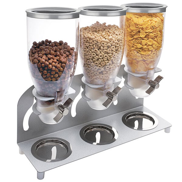 A Cal-Mil triple cereal dispenser with glass jars filled with cereal.