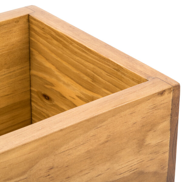 A Cal-Mil Madera rustic pine rectangle plate riser on a table with a white background.