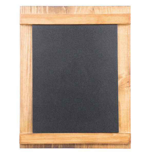 A blackboard in a wooden frame on a table.