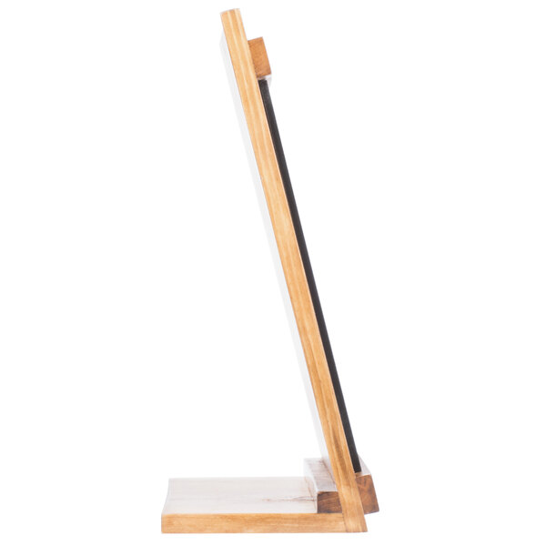 A wood Cal-Mil Madera table stand with a black chalkboard.