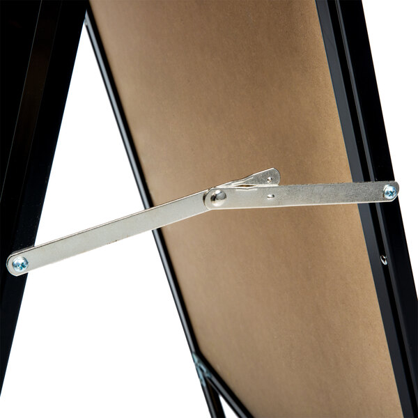 A black metal A-Frame sign board with a black marker board on it.