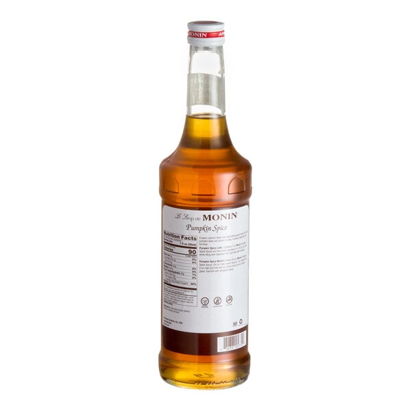 A 750 mL bottle of Monin Premium Pumpkin Spice Flavoring Syrup.