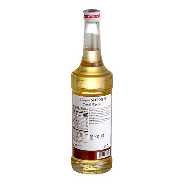 A Monin Premium French Vanilla Flavoring Syrup bottle on a white background.