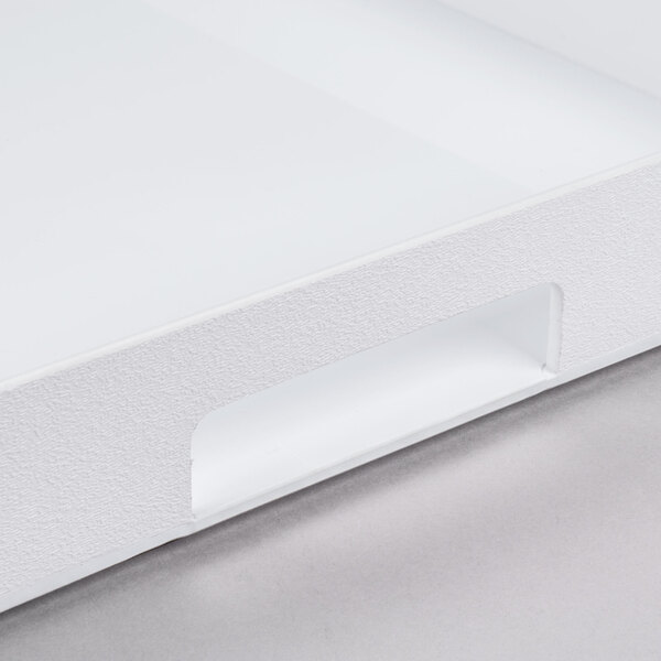 A white plastic Cal-Mil room service tray with handles.