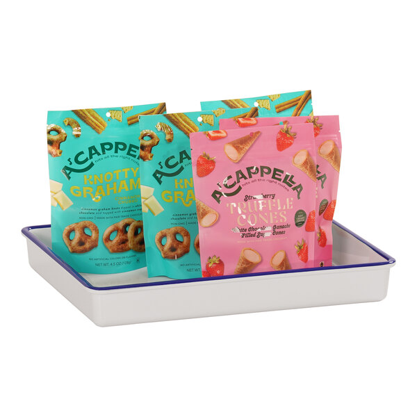 A Cal-Mil white deep melamine tray with blue rim holding a variety of food.