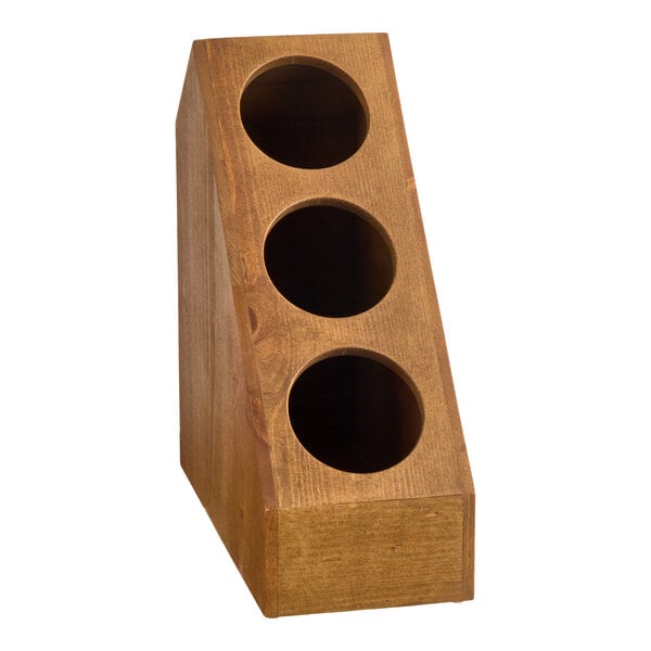 A wooden slanted display with three circular compartments for holding flatware or condiments.