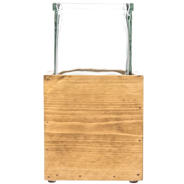 A Cal-Mil Madera rustic pine riser with a glass jar on top.