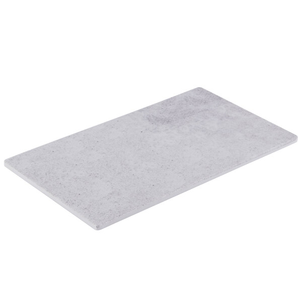 A white rectangular Cal-Mil faux cement serving platter.