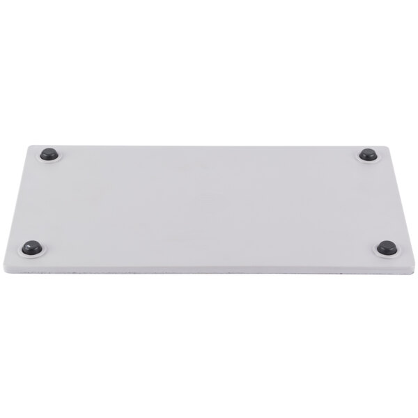 A white rectangular melamine serving platter with a faux cement design.