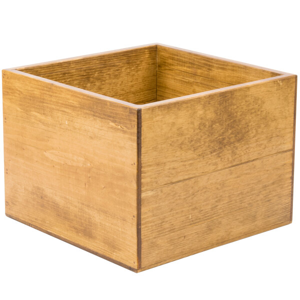 A wooden square display riser with a square top.