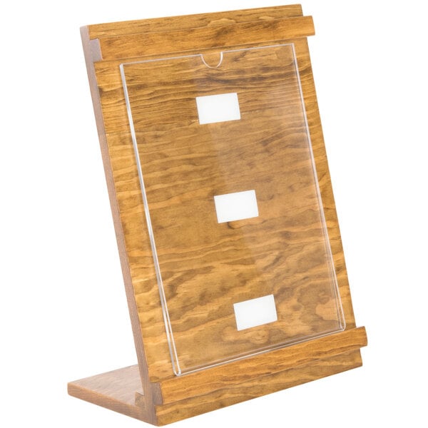 A Cal-Mil wood displayette with clear plastic panels on a table.