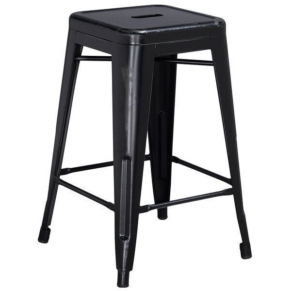 A Flash Furniture distressed black metal counter height stool with a square seat.