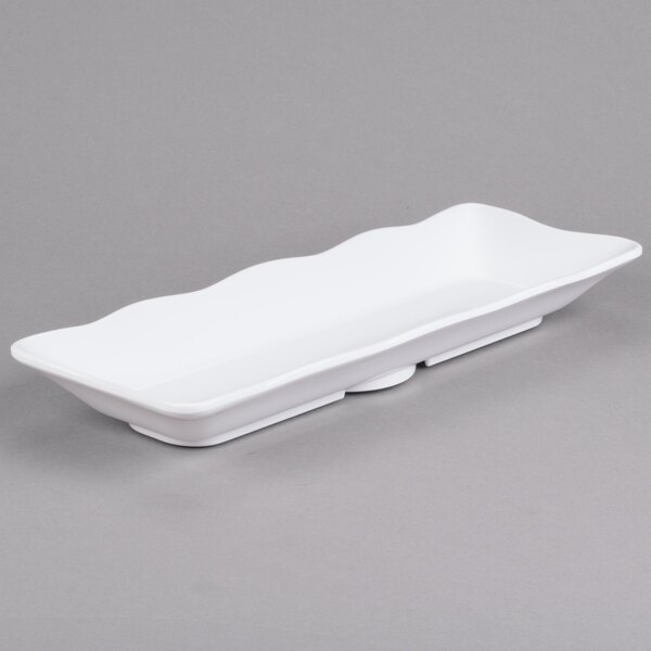 A white rectangular melamine tray with scalloped edges.