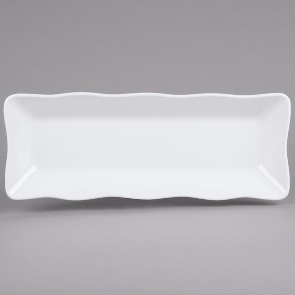 A white rectangular melamine tray with a scalloped edge.