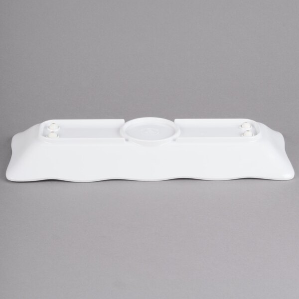A white rectangular melamine tray with scalloped edges.