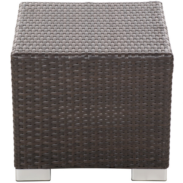 A BFM Seating Aruba Java wicker end table with a metal base.