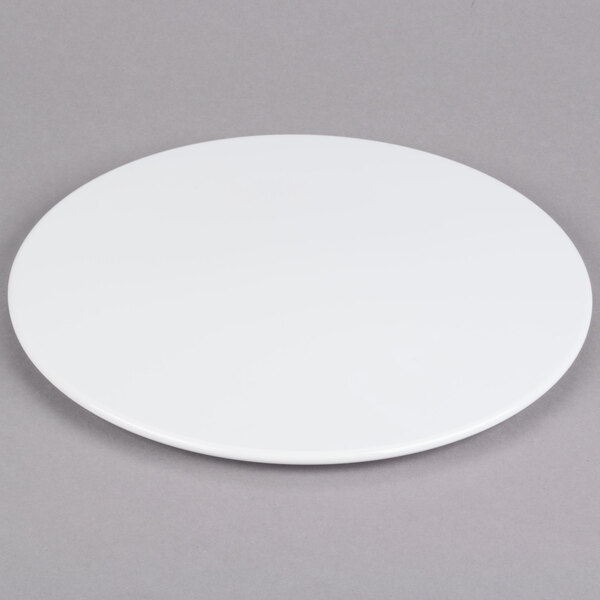 An Elite Global Solutions white melamine plate on a gray surface.