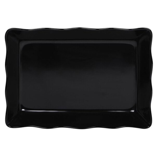 A black rectangular melamine tray with scalloped edges.
