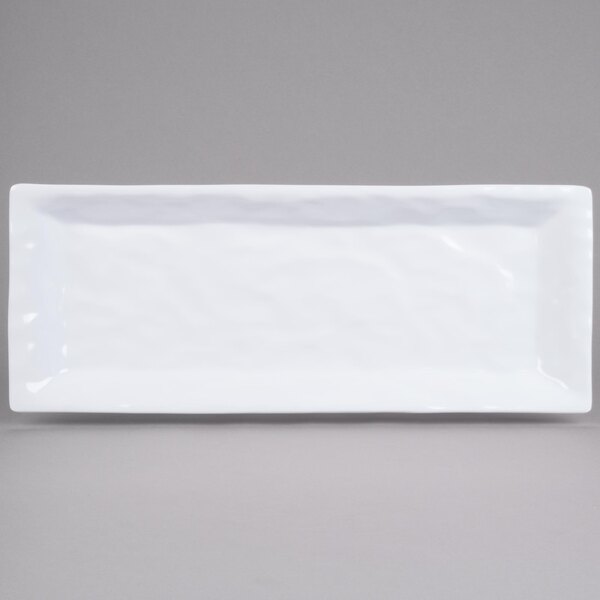 A white rectangular melamine tray with a crinkled surface and white rim.