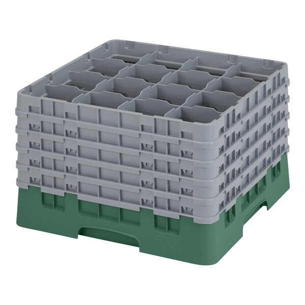 A stack of grey Cambro plastic containers with green handles and holes.