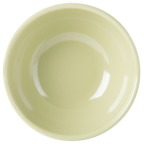 A close-up of a Cal-Mil sage melamine bowl.