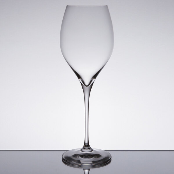 A Spiegelau Adina Prestige red wine glass on a table.