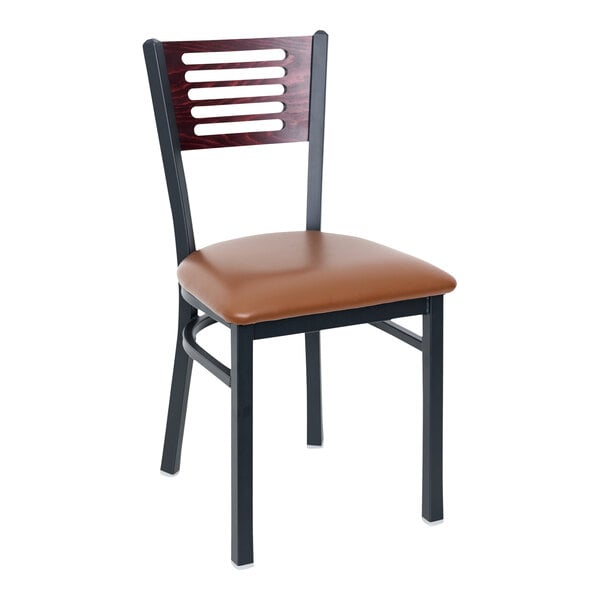 A BFM Seating black metal side chair with mahogany wood back and light brown vinyl seat.