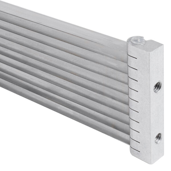 A metal Choice Prep tomato slicer blade assembly with two holes in it.