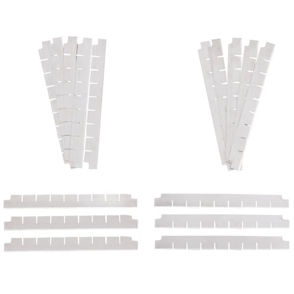 A set of several white plastic strips with holes.